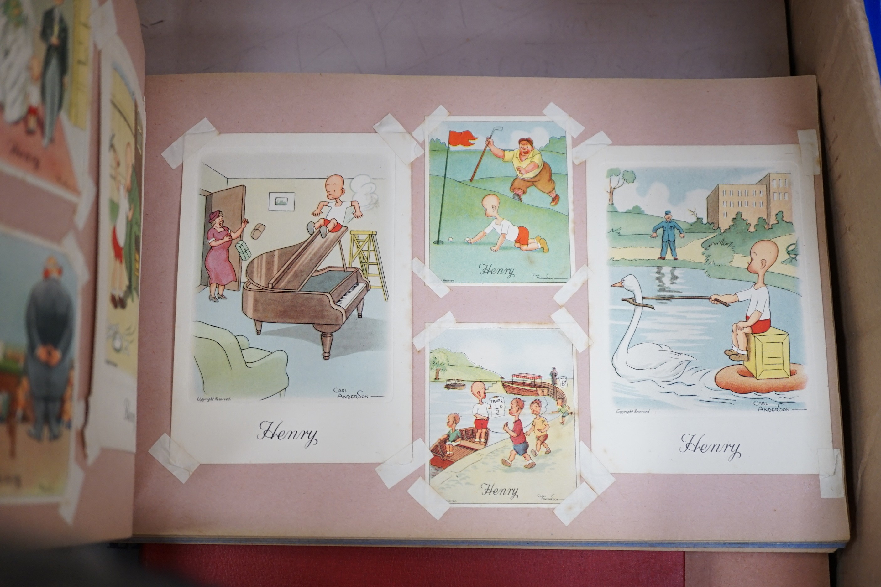 A ‘Henry’ postcard album, together with various Second World War cartoon/scrap books and political cartoons